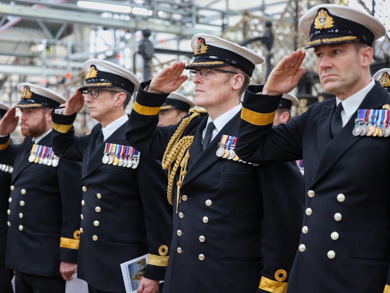 Pictured- Senior officers attending the Annual Trafalgar Day Ceremony at HMS Victory - as they hold a one minute salute.