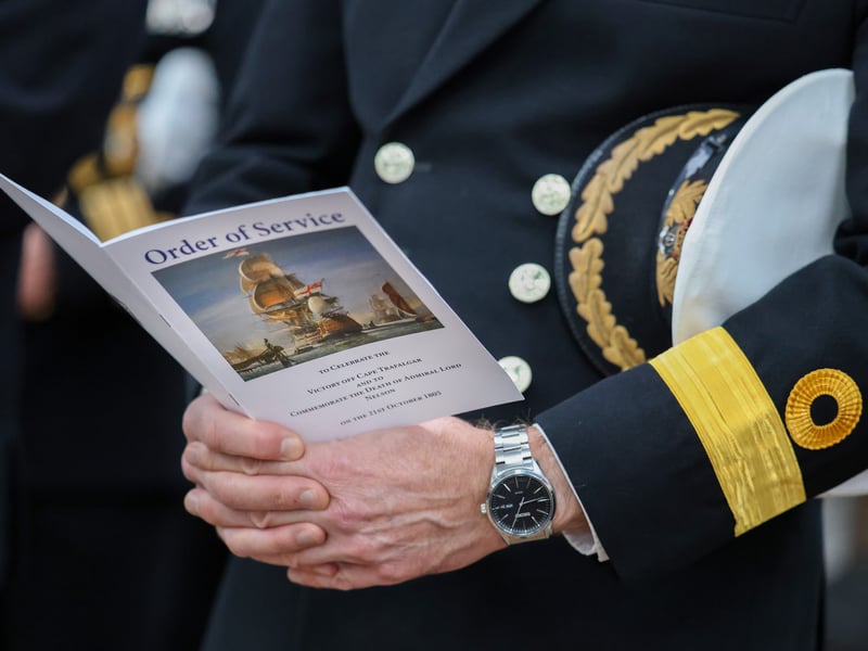Pictured - Order of service for the annual Trafalgar Day ceremony being held by a Commodore attending the event.