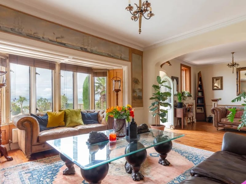 The listing says: "Constructed in approximately 1854 forming one of a pair of waterfront properties owned by two sisters, The Dolphins is a beautiful and fascinating property."