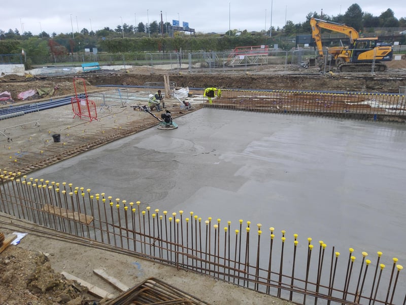 Concrete that has been poured onto the base of the pool, bringing it to its final level. 
