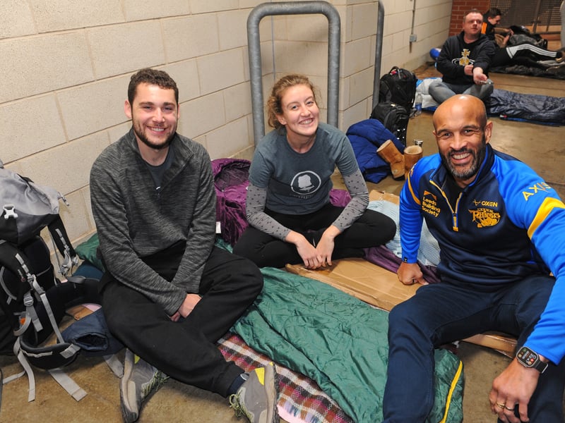 Jamie Jones-Buchanan gives a Rhinos support for James Guinan and Heather Bragg as they settle down for the night.
