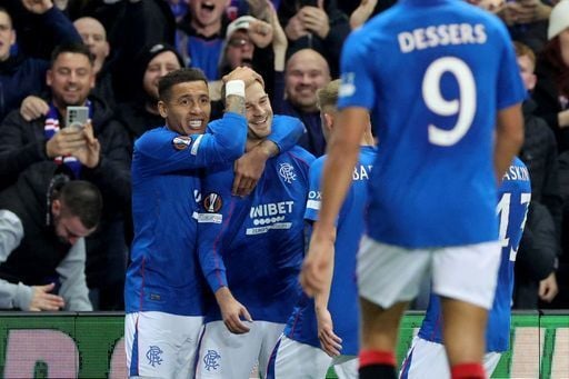 James Tavernier helps Vaclav Cerny celebrate his goal with players and fans.