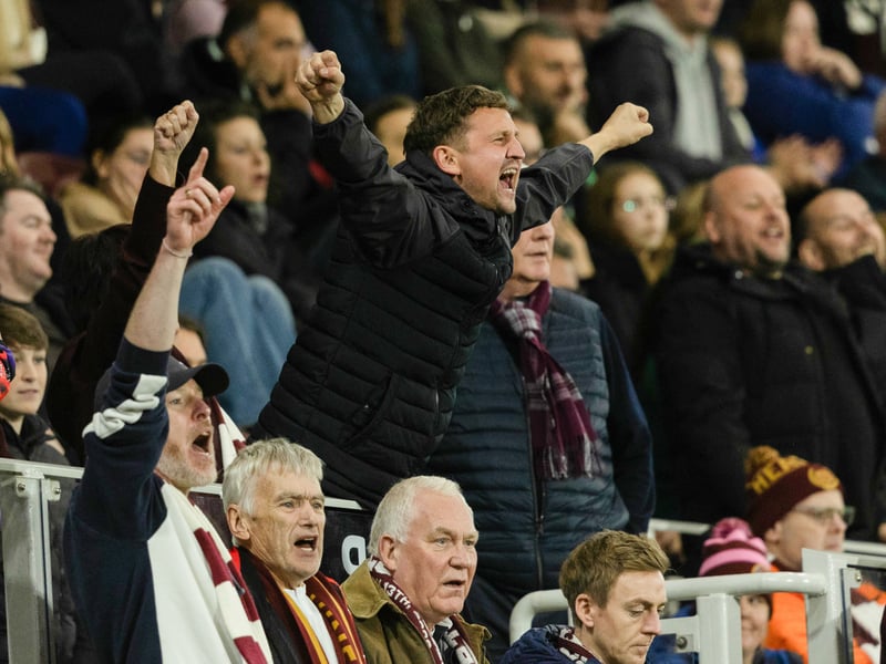 One Hearts fan shows his delight at the team's performance.