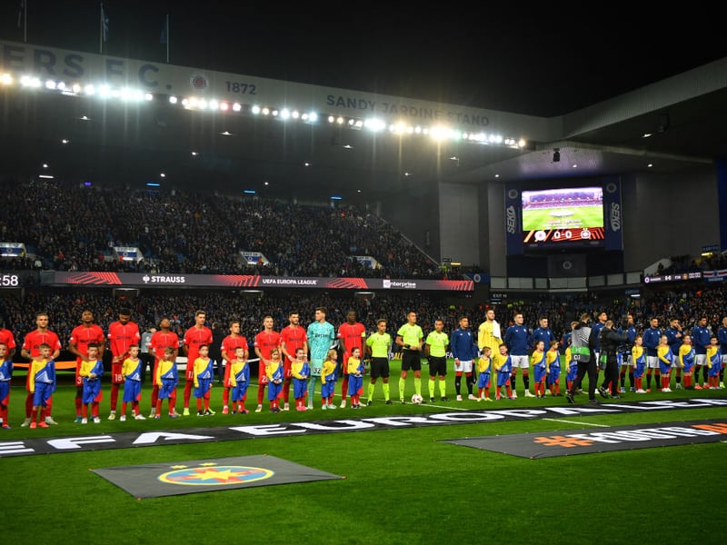 Fans fill the stands as the two side's line-up for kick-off.