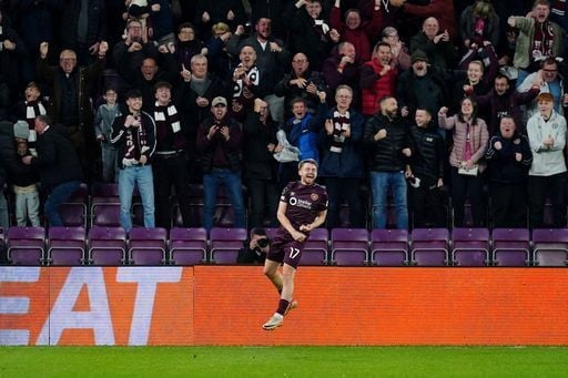 Alan Forrest celebrates with the supporters after scoring the opening goal of the game.