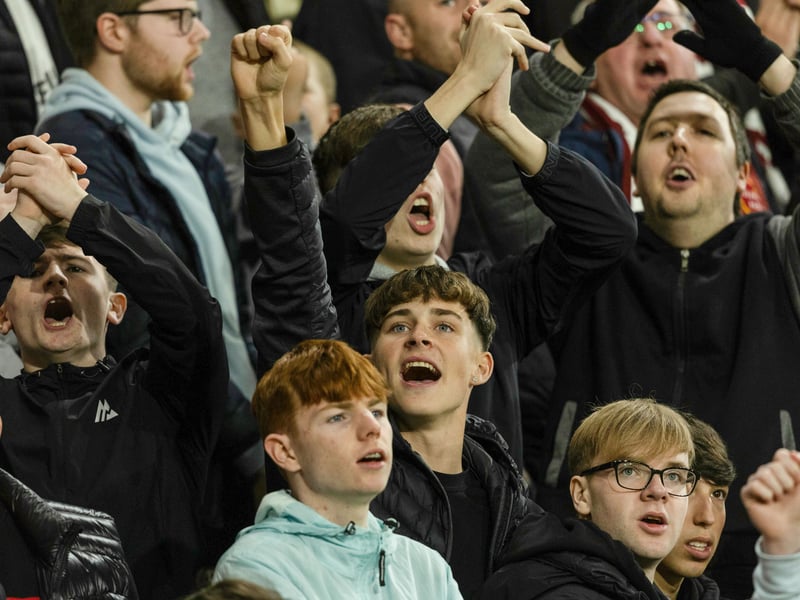 Hearts fans celebrate the Conference League win at Tynecastle.