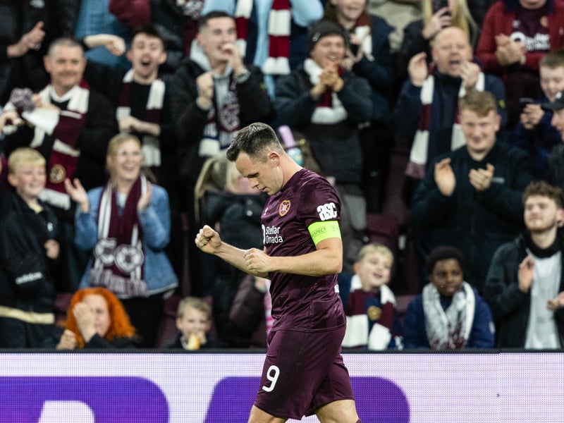 Lawrence Shankland celebrates his team's performance with the Tynecastle faithful.