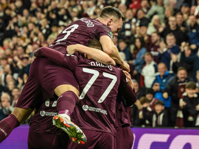 Supporters help Blair Spittal and the team celebrate after the midfielder makes it 2-0 at Tynecastle.