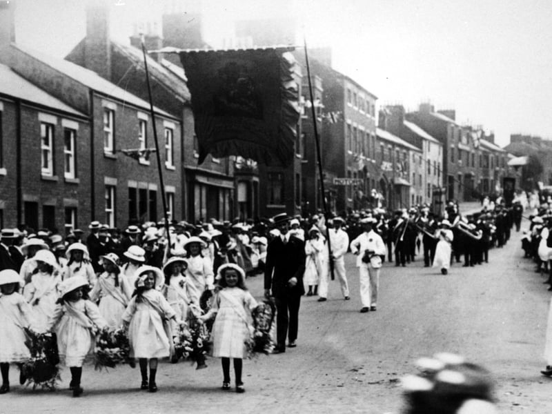Early Kirkham and Wesham Club day procession - early 1900s - along Poulton Street, Kirkham, led by little flower girls, with brass band in background