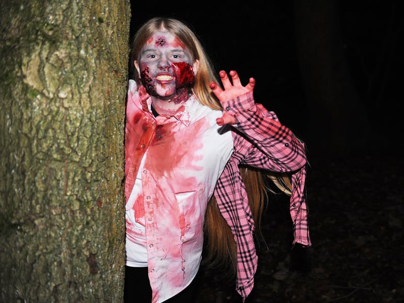 Esmae Emsley peeps out to scare the walkers.