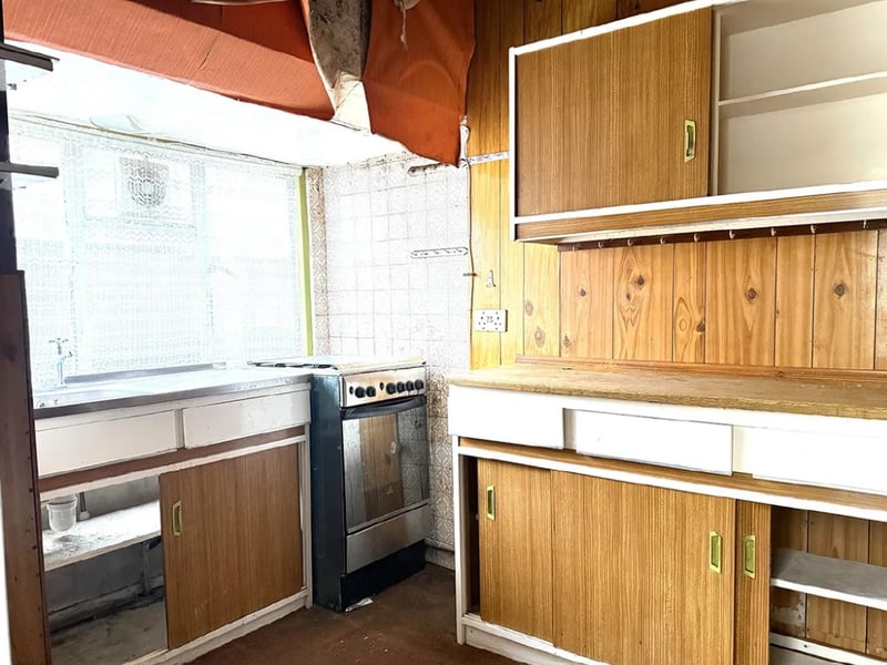 This home comes with three bedrooms, a kitchen, living space and a bathroom. 