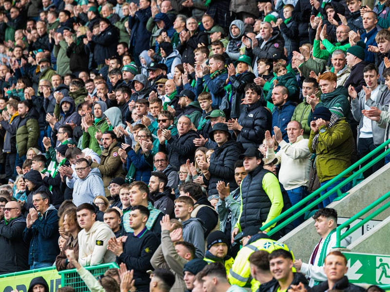 Fans participate in a minute's applause for former Hibs player Peter Cormack.