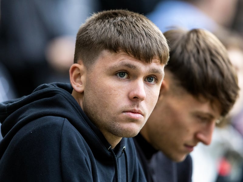 Former Hearts player Connor Smith watches on.