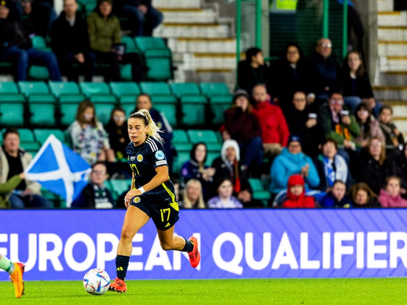 Supporters watch on as Kirsty Smith drives at the Hungary defence.