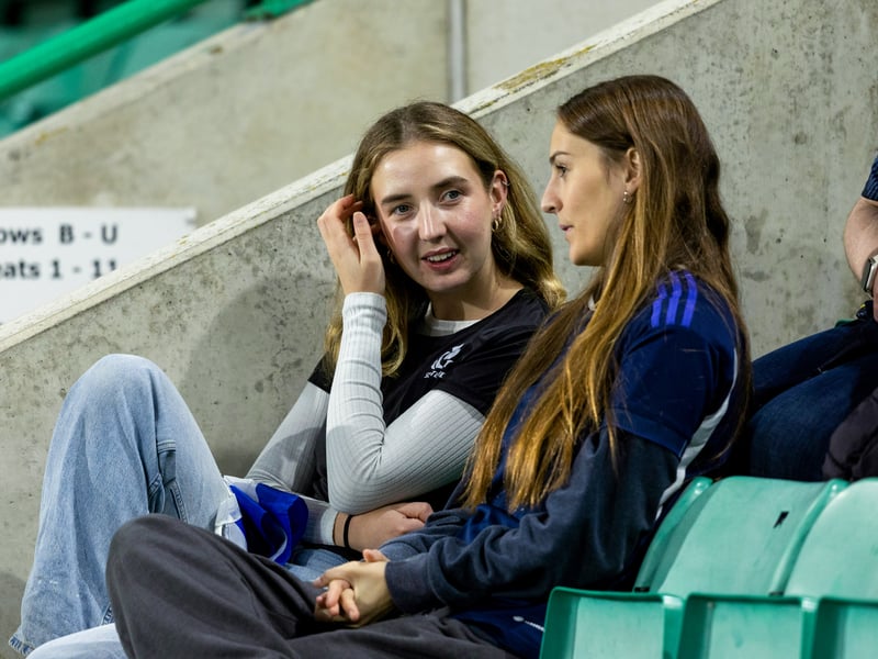 Two Scotland fans deep in conversation before the game at Easter Road.