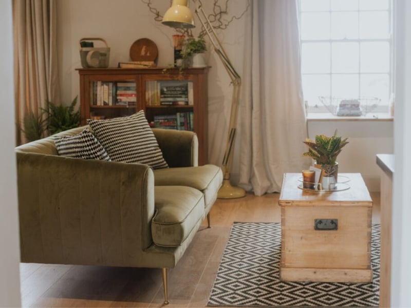 There's a comfy couch perfect to cuddle up for the evening.