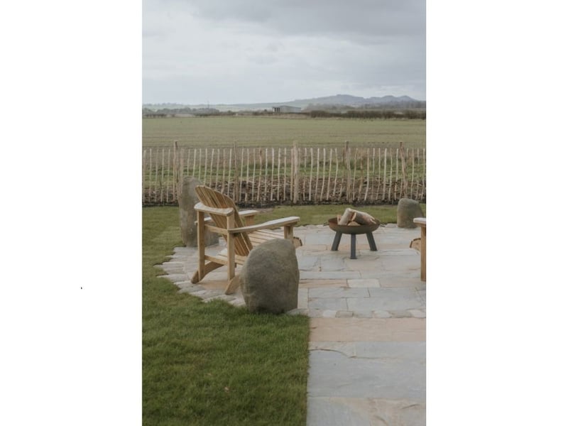 The outside seating area is perfect for everything from a picnic lunch, to stargazing next to the firepit.