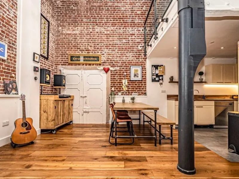 The listing says: "The Vulcan Building, Grade II listed, Built around 1812, this iconic former armoury, blends historical charm with modern flair in the heart of the vibrant Gunwharf Quays marina complex." 