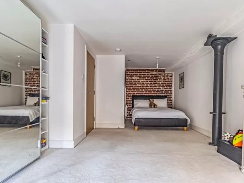 The listing says: " This remarkable apartment includes an allocated off-road parking space and exudes character with its seamless mix of heritage and contemporary style."
