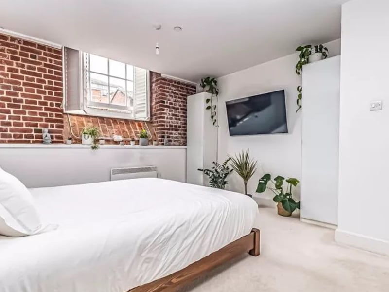 The listing says: " Expertly transformed in 2005, this unique building now houses, high-demand apartments and boasts an impressive clocktower that stands as a local landmark."