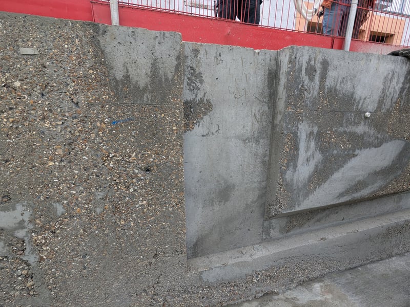 The first sections of the pool wall have now been formed and the shuttering removed. In this section, you can see a recess where on the ladders for exiting the pool will go, along with a horizontal notch which will act as a footrest in the deepest area of the pool.