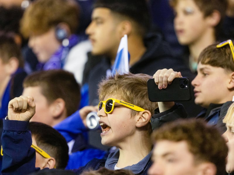 These young fans take in the match.