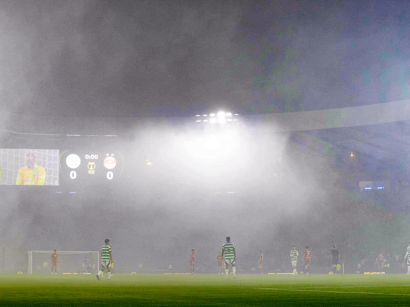 A general view as smoke descends on the pitch from pyrotechnics and delays kick-off.