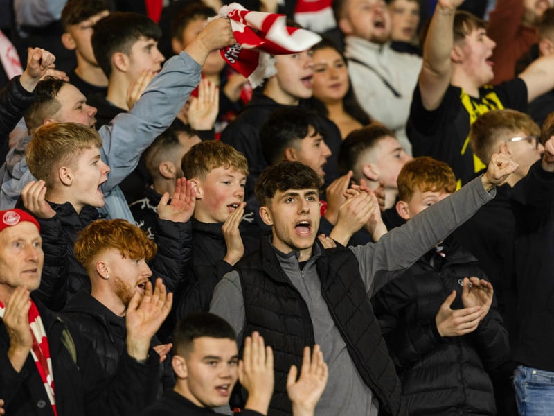 The travelling Dons support roar on the team despite their 6-0 hammering.