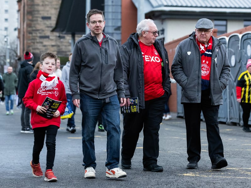 Four Aberdeen supporters head to Hampden Park.