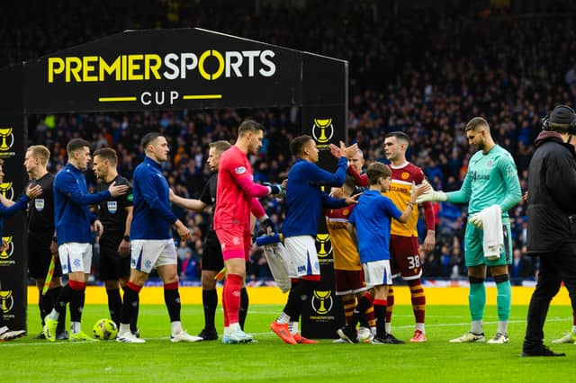 Rangers and Motherwell players shake hands before the Premier Sports Cup semi-final at Hampden. (Photo by Craig Foy / SNS Group)