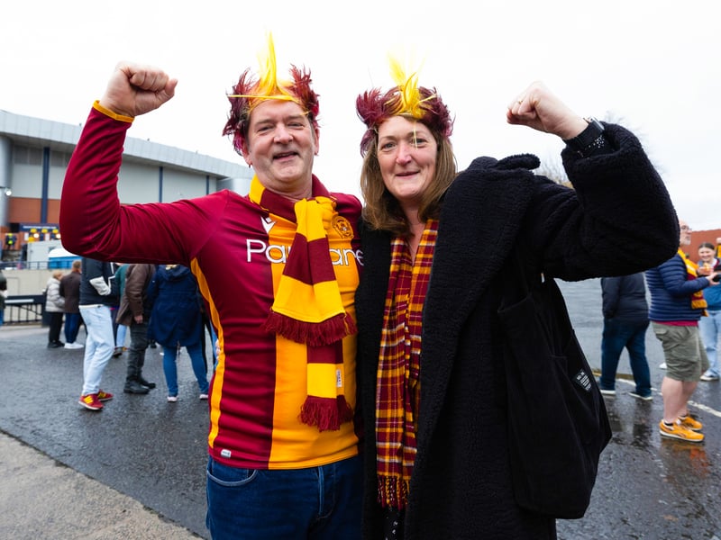 Two Motherwell fans soak in the pre-game atmosphere.
