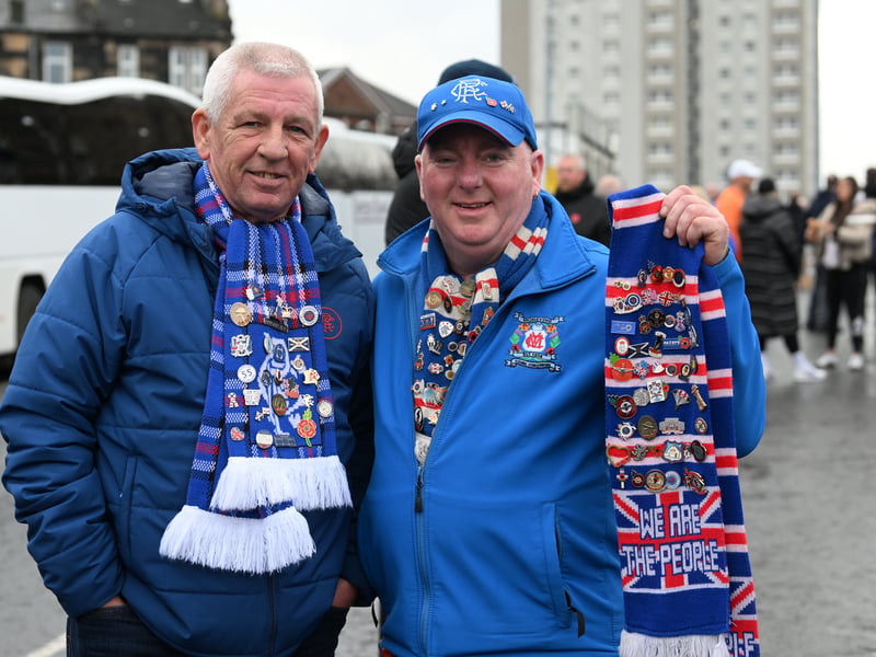 Two Rangers fans show off their Gers scarves before kick-off.