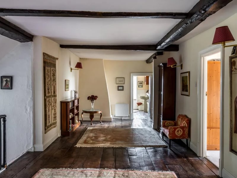This home comes with a dry moat, a swimming pool and a pool house.