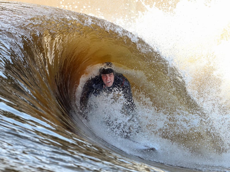 Surfer Mark Boyd catches a wave. The Lost Shore resort offers visitors onsite accommodation, restaurant, bar, surf lessons, and wellness centre. Picture: Jeff J Mitchell/Getty Images