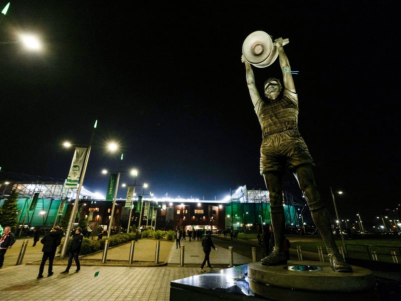 A general view of the Billy McNeill statue outside the stadium as fans head into the stadium.