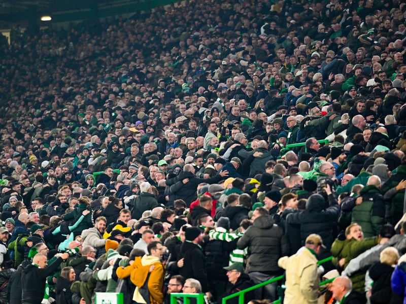 The Celtic fans celebrate.