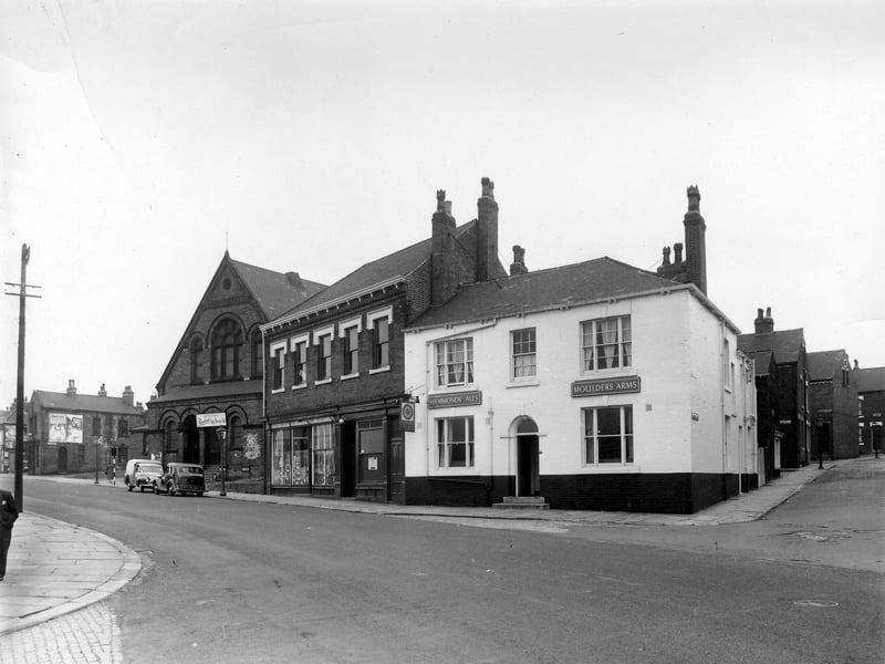 The junction of Cherry Row with Lincoln Road in August 1958. This part of Burmantofts was also known as Newtown. At the very left edge is Lincoln Field Row, then, with advertising on the side of the end property, is Lincoln Street. The building with the arched doors and windows is the old Lincoln Fields Wesleyan Methodist Sunday School, at number 6 Hill Street, located at the junction with Cherry Row and Hill Street.