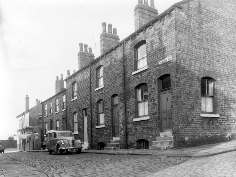 Primrose Row from the junction with Primrose Place looking towards Dolly Lane in October 1958. Far left is the Tulip Inn. From left to right are house numbers 8 descending to 2 Primrose Row. These houses were eventually cleared and Primrose High School was built in the vicinity. The locality is known as Newtown.