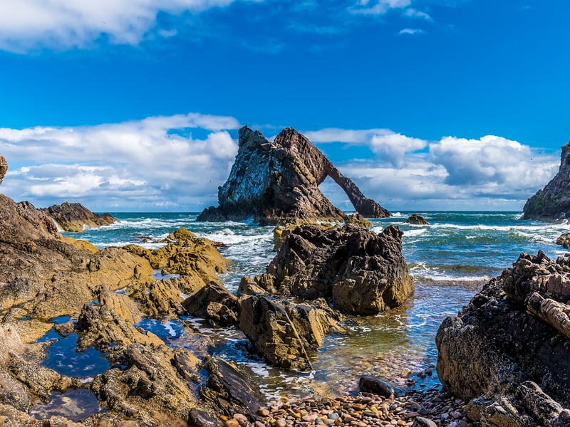 Located near Portknockie in the north-east of Scotland, Bow Fiddle Rock is a natural sea arch which many make sure to stop and visit for not just for its beauty, but to see the many birds which nest there. 