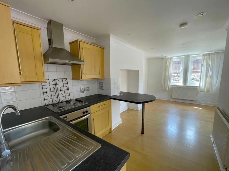 The listing says: "We invite immediate offers (strictly on Auction terms) for this exceptionally well-situated and lucrative investment opportunity, being a very substantial, virtually detached character residence arranged as 5 apartments." 
