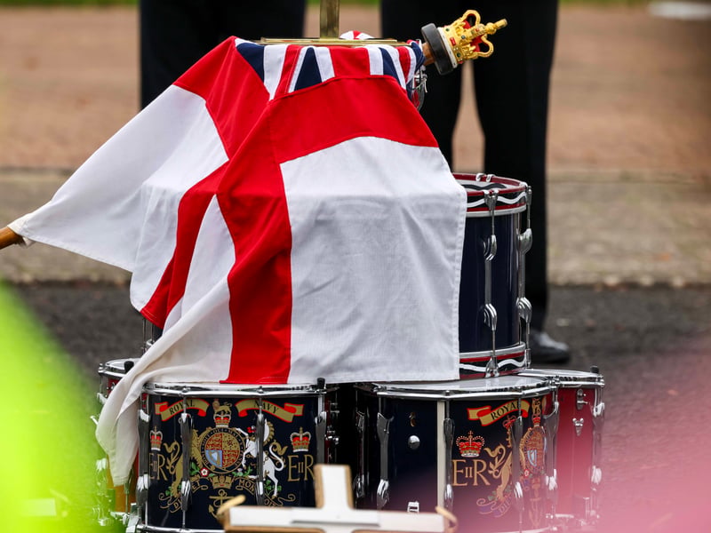 The service of remembrance uses neatly piled drums as an alter.