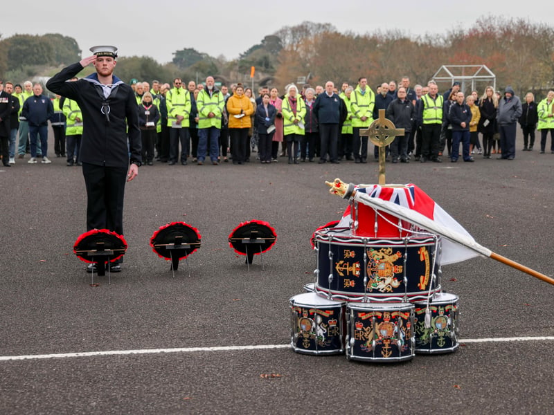 Trainee engineering technician marine engineering William Lamont lays a wreath at the Drumhead Ceremony.