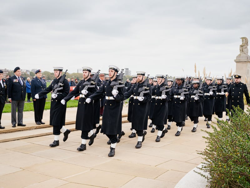 Pictured is: The Royal Navy guard marches on passing veterans.