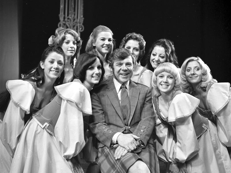 Scottish entertainer Andy Stewart with the girls of the 'Scotch Corner' chorus line at the King's theatre in Edinburgh, May 1974.