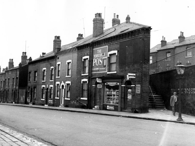 A view of Servia Hill, the newsagents shop was number 49, business of Brian Kirby. To the right of the shop are steps which lead to Grosvenor Hill, part of which can be seen.