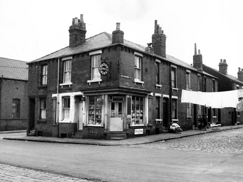 Oxford Road, on the left is Stonefield and the back of the Roscoe Clothing Company. Number 15 Oxford Road is an off licence shop, business of Brenda Fowler. Stonefield Street is to the right.