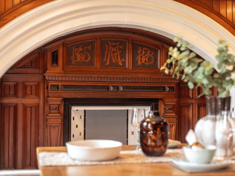 Among many features of Old Craig is the wood panelled dining room with large fireplace and a beautifully carved inscription.