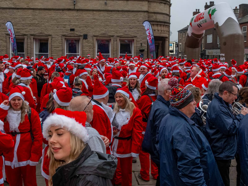 A sea of santas preparing to go