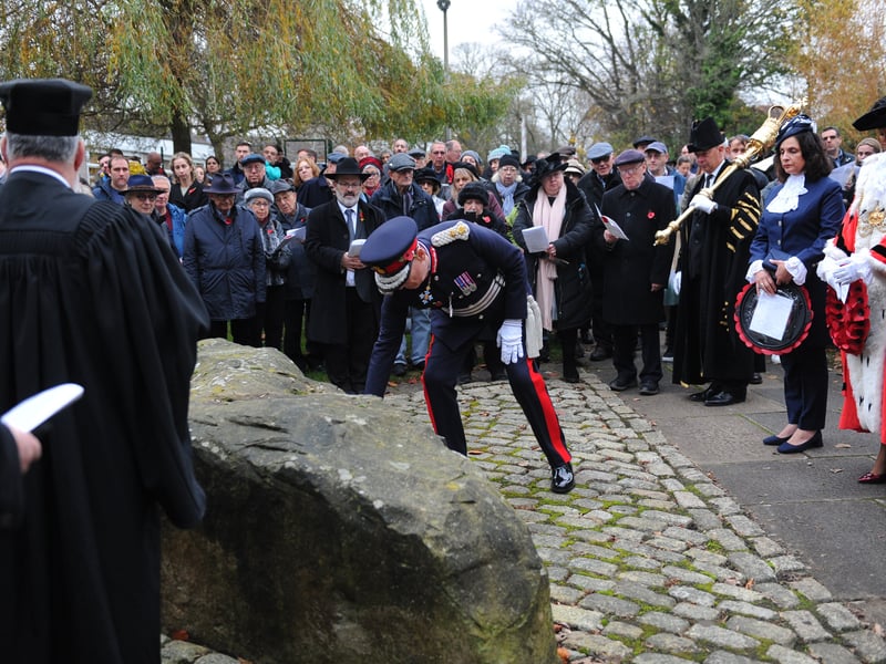 The Lord-Lieutenant of West Yorkshire Ed Anderson lays a wreath at the Remembrance Service