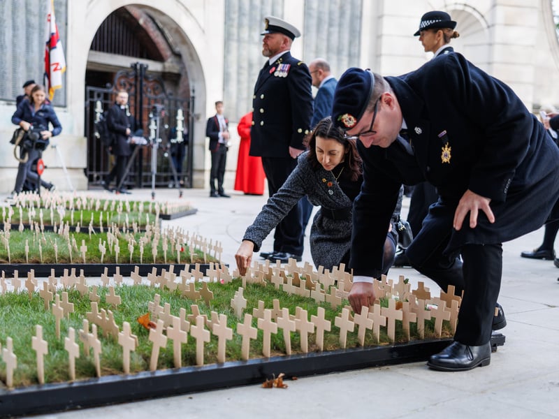 Cllr Tom Coles and Nikki Coles planting a cross at the cermony